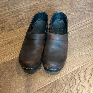 Size 38 used Dansko clogs. Brown leather.